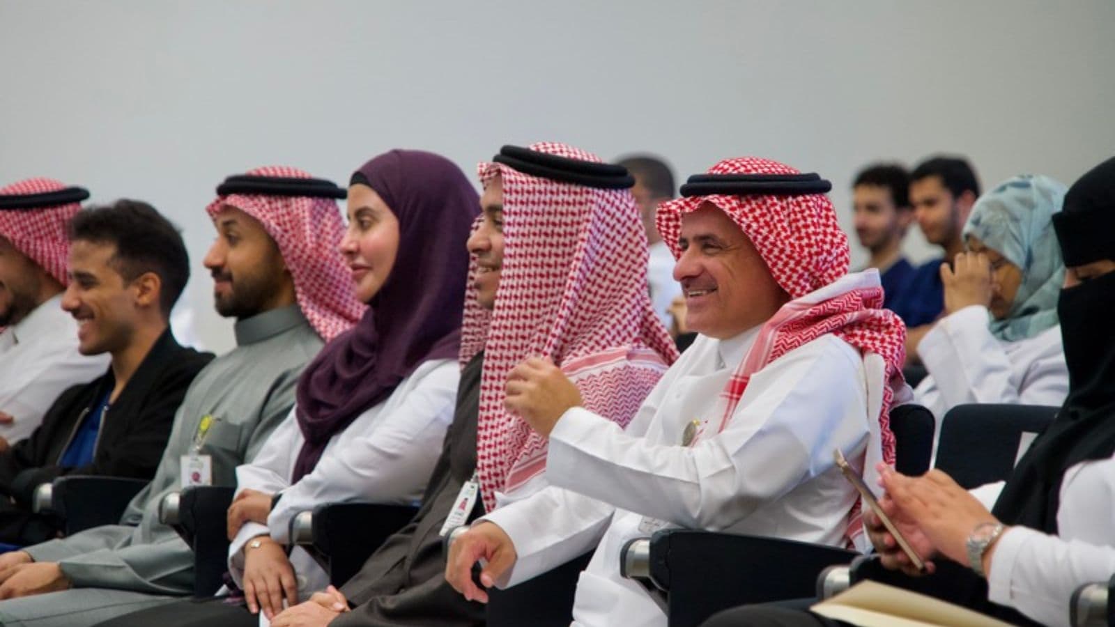 Attendees listening closely during a Student Academy event